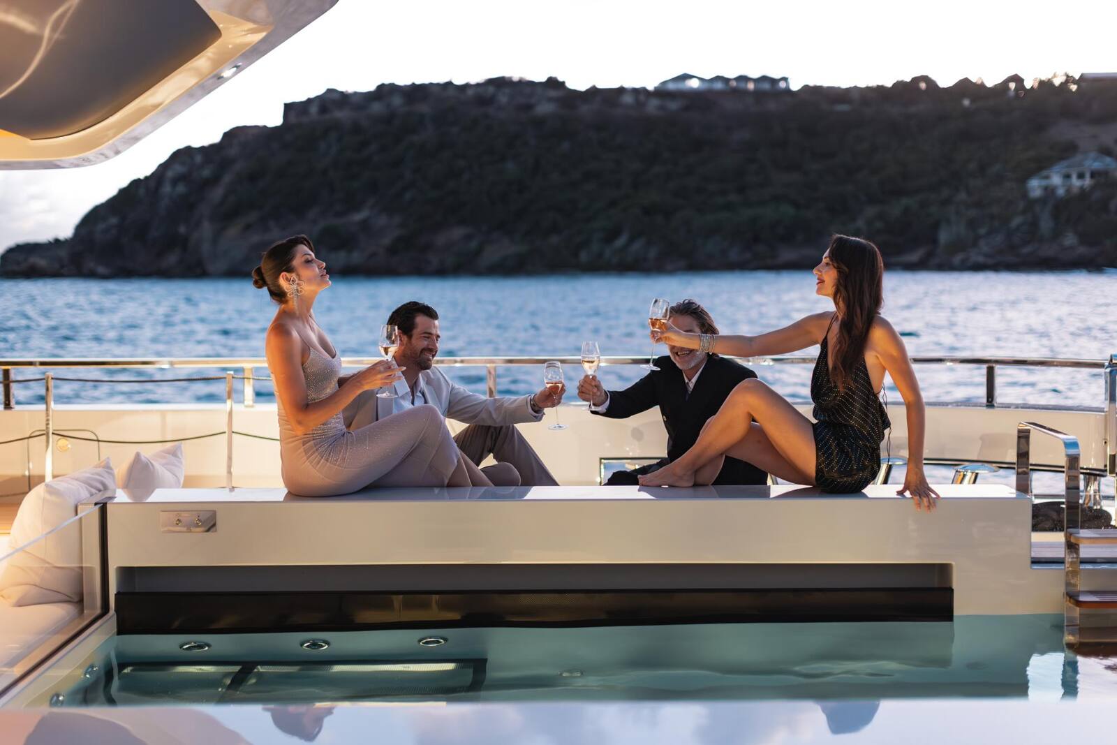 Friends gathered for cocktails on deck during a charter